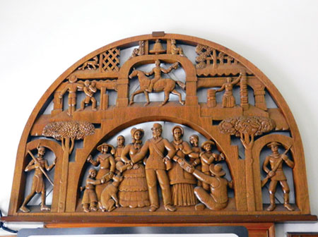 Art in Our City: Historic Wood Carved Scenes Adorn Post Office Wall