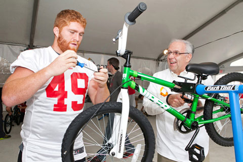 49ers Help Build Bicycles for Youth