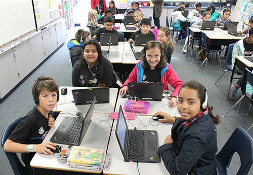 Fifth Graders at Laurelwood School Practice Computer Programming During the Hour of Code