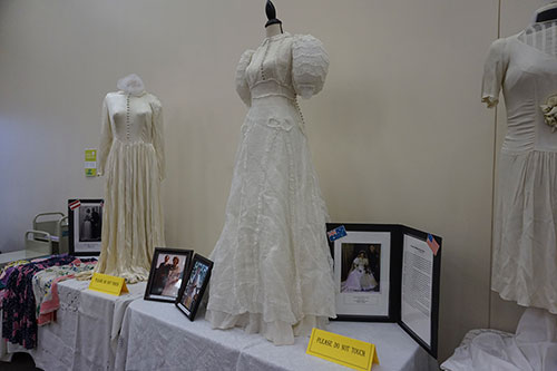 Headline: WWII wedding dresses displayed at library